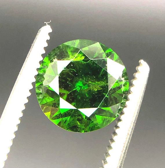 Demantoid Garnet gemstone with brilliant green color