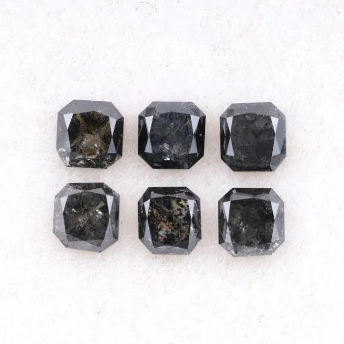 Salt-and-pepper diamond showing visible black gray and white inclusions